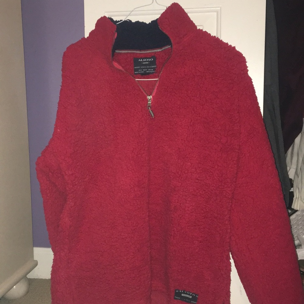 Red half zip up fuzzy, with navy collar